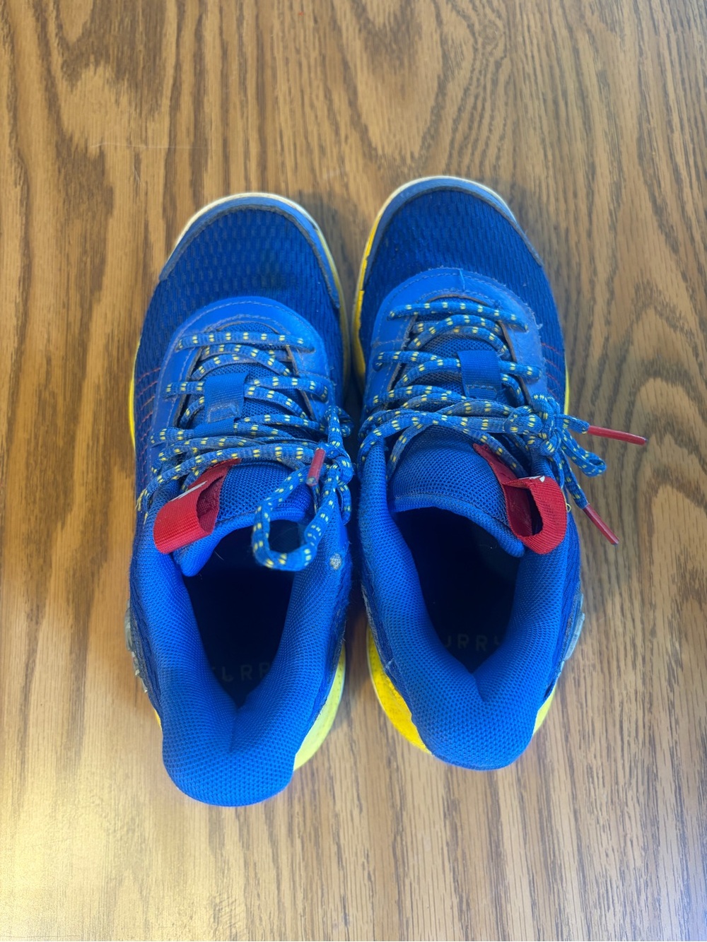 Under Armour Kids Blue Sneakers with Yellow and Red Accents